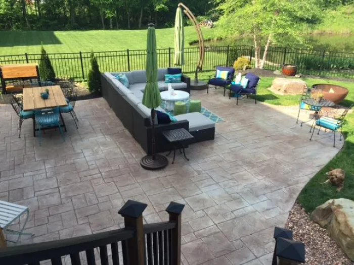 Large Stamped Red Concrete Patio with Furniture