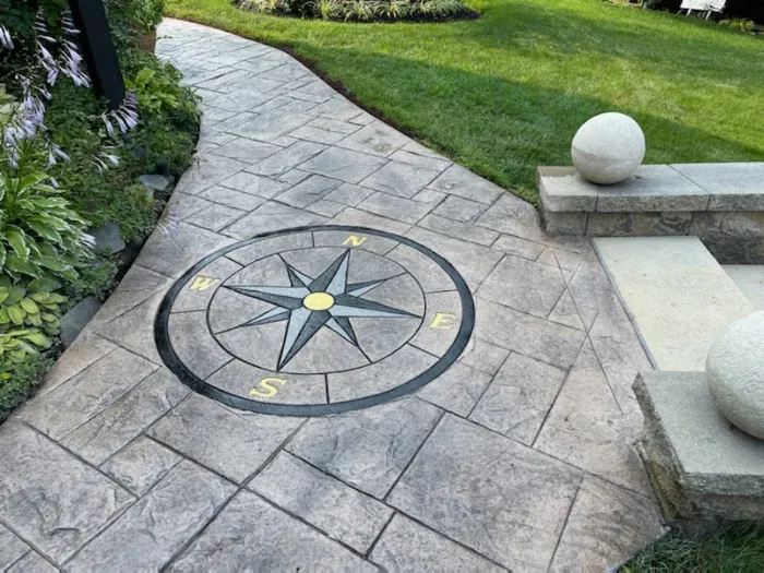 Stamped Concrete Walkway With inscribed Decorative Compass Design