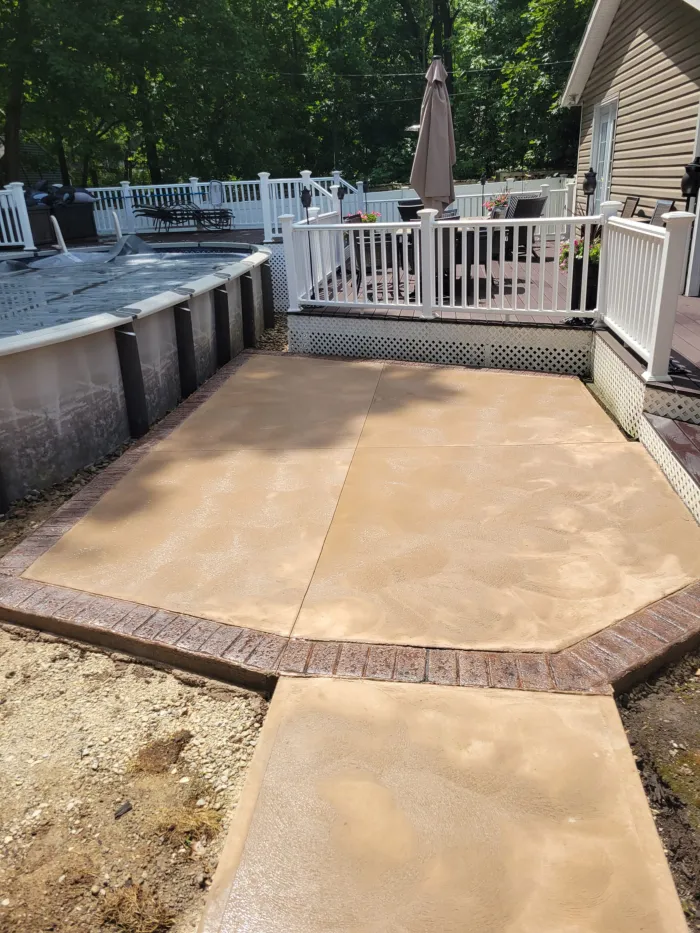 Stamped concrete pool deck with a custom edge