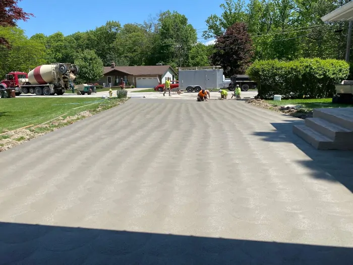 Concrete crew finishing up pouring a large Concrete Parking Lot