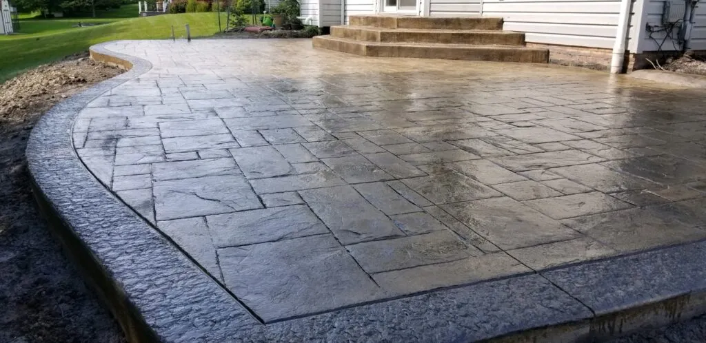 Fancy Decorative stamped concrete patio with stamped highlight border