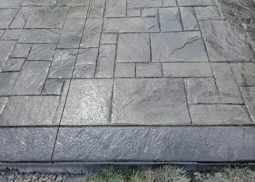 Picture of decorative concrete with a stamped textured edge